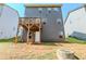 Home's backyard shows a deck, gray siding, and an easy to mow lawn at 169 Parkview Place Dr, Mcdonough, GA 30253