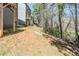 View of the home's backyard with trees along the property's edge at 169 Parkview Place Dr, Mcdonough, GA 30253