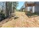 Backyard view with the treeline from the edge of the property at 169 Parkview Place Dr, Mcdonough, GA 30253