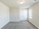 Bright bedroom with neutral walls, plush gray carpeting and double door closet at 169 Parkview Place Dr, Mcdonough, GA 30253