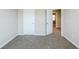 Neutral bedroom with plush carpeting, and white doors at 169 Parkview Place Dr, Mcdonough, GA 30253