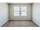 Comfortable bedroom with gray carpet, neutral walls, and natural light at 169 Parkview Place Dr, Mcdonough, GA 30253
