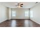 Spacious living room with hardwood floors, ceiling fan, and plenty of natural light at 169 Parkview Place Dr, Mcdonough, GA 30253