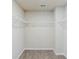 Walk-in closet with gray carpeting and wire shelving at 169 Parkview Place Dr, Mcdonough, GA 30253