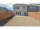 View of the home's back exterior highlighting the fenced backyard, patio, and second story windows at 5895 Sheppard Dr, Cumming, GA 30040