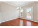 Bright dining area featuring hardwood floors and access to the backyard at 5895 Sheppard Dr, Cumming, GA 30040