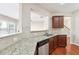 Beautiful kitchen featuring granite countertops, stainless steel appliances, and a breakfast bar at 5895 Sheppard Dr, Cumming, GA 30040
