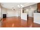 Open floor plan showcasing the living room with fireplace, kitchen, and dining area at 5895 Sheppard Dr, Cumming, GA 30040