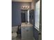 Cozy bathroom with a white vanity, ample lighting, and a neutral color scheme at 851 Hedge Garden Ct, Stone Mountain, GA 30088