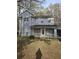 Charming two-story home with a welcoming covered front porch and a well-maintained yard at 851 Hedge Garden Ct, Stone Mountain, GA 30088