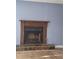 Inviting living room with a classic wood-framed fireplace and durable flooring at 851 Hedge Garden Ct, Stone Mountain, GA 30088