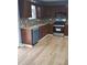 Well-equipped kitchen featuring modern appliances, wooden cabinetry, and stylish backsplash at 851 Hedge Garden Ct, Stone Mountain, GA 30088