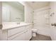 Clean bathroom featuring a vanity, toilet, and shower-tub combo with white finishes at 1042 Edwin Ln, Sugar Hill, GA 30518