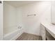 Bright bathroom featuring tub, modern vanity with countertop and plank flooring at 1042 Edwin Ln, Sugar Hill, GA 30518