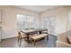 Dining area with a wooden table, comfortable seating, and natural light at 1042 Edwin Ln, Sugar Hill, GA 30518