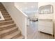 Inviting foyer with staircase, stylish shoe storage, and a view of the open living area at 1042 Edwin Ln, Sugar Hill, GA 30518