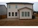 Back exterior of home features a patio and spacious backyard at 290 Brighton Bend Ln, Acworth, GA 30102