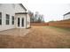A view of the home's large backyard, with a patio and a partial view of the house at 290 Brighton Bend Ln, Acworth, GA 30102