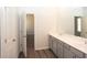 Bathroom featuring double sinks and luxury vinyl plank flooring at 290 Brighton Bend Ln, Acworth, GA 30102