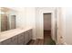 Bathroom featuring double sinks, a shower, and luxury vinyl plank flooring at 290 Brighton Bend Ln, Acworth, GA 30102