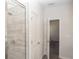 Bathroom featuring a glass shower with tile and luxury vinyl plank flooring at 290 Brighton Bend Ln, Acworth, GA 30102