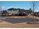 View of the community center with parking and tree landscaping at 290 Brighton Bend Ln, Acworth, GA 30102