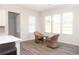 Cozy breakfast nook featuring a table with seating, a modern chandelier, and a large window at 290 Brighton Bend Ln, Acworth, GA 30102