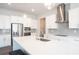 Modern kitchen featuring white cabinets, stainless steel appliances, a central island, and gray subway tile backsplash at 290 Brighton Bend Ln, Acworth, GA 30102