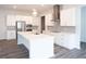 Modern kitchen featuring white cabinets, stainless steel appliances, a central island, and gray subway tile backsplash at 290 Brighton Bend Ln, Acworth, GA 30102