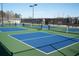 Community pickleball court with blue and green surface and black fencing at 290 Brighton Bend Ln, Acworth, GA 30102