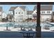 Community pool with lounge seating, set amongst neighborhood homes on a sunny day at 290 Brighton Bend Ln, Acworth, GA 30102