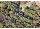 Aerial shot of home, set amidst lush green trees, road visible at 440 Dix Lee On Dr., Fayetteville, GA 30215