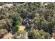 Stunning aerial view of a brick home nestled among lush trees in a serene, wooded setting at 440 Dix Lee On Dr., Fayetteville, GA 30215