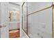 En-suite bathroom featuring shower-over-tub with brass fixtures and walk-in access at 440 Dix Lee On Dr., Fayetteville, GA 30215