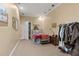 Neutral bedroom features carpet, a bed with blue bedding, and closet access at 440 Dix Lee On Dr., Fayetteville, GA 30215