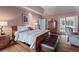 Cozy bedroom with a large bed, an ensuite bathroom, and a sitting area at 440 Dix Lee On Dr., Fayetteville, GA 30215