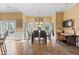 Open dining area with large windows, a chandelier, access to the deck, and space for a desk or additional seating at 440 Dix Lee On Dr., Fayetteville, GA 30215