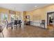 Open dining area with tile floors, large windows, a desk, and access to the bathroom at 440 Dix Lee On Dr., Fayetteville, GA 30215
