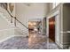 Elegant foyer showcases marble floors, a staircase, a chandelier, and a wooden front door at 440 Dix Lee On Dr., Fayetteville, GA 30215