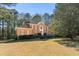 Beautiful brick home with a manicured lawn, red shutters, and a charming front entrance at 440 Dix Lee On Dr., Fayetteville, GA 30215