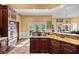 Modern kitchen with a granite island, stainless appliances, custom cabinets, and adjoining dining area at 440 Dix Lee On Dr., Fayetteville, GA 30215