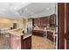 Large kitchen with granite countertops, custom cabinets, stainless steel appliances, breakfast bar, and open layout at 440 Dix Lee On Dr., Fayetteville, GA 30215