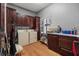 Functional laundry room with washer, dryer, and storage cabinets for easy organization at 440 Dix Lee On Dr., Fayetteville, GA 30215