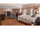 Serene main bedroom with a fireplace and comfortable seating, offering a relaxing retreat at 440 Dix Lee On Dr., Fayetteville, GA 30215