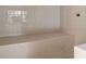 Tiled shower with built-in bench and tiled walls for a clean and modern look at 440 Dix Lee On Dr., Fayetteville, GA 30215