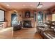 Home theater with a fireplace, wood paneling, leather seating, and custom curtains at 440 Dix Lee On Dr., Fayetteville, GA 30215