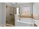 Bathroom features a stand-alone shower and separate bathtub at 1570 Lenox Overlook Ne Rd, Atlanta, GA 30329