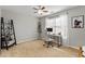 Bedroom features a home office setup with natural light and wood shelving at 1570 Lenox Overlook Ne Rd, Atlanta, GA 30329