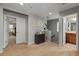 Upstairs landing with neutral colors featuring a decor cabinet and decor art at 1570 Lenox Overlook Ne Rd, Atlanta, GA 30329