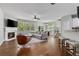 Bright and open living room with hardwood floors, fireplace, and a cozy seating area at 1570 Lenox Overlook Ne Rd, Atlanta, GA 30329